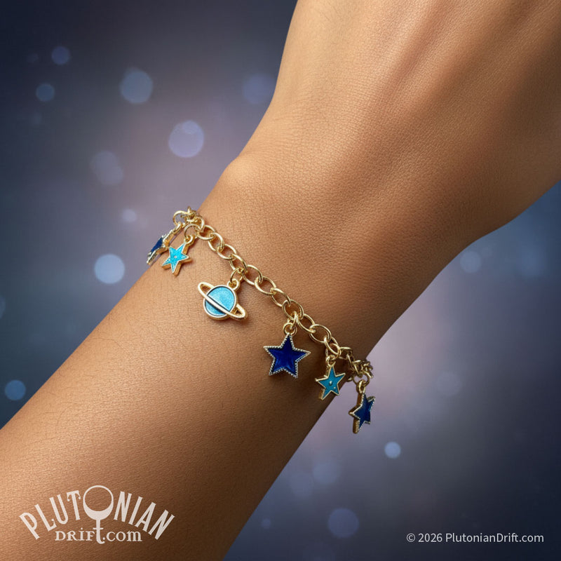 Travel Guide - Galactic tour charm bracelet. A person's wrist wearing a gold tone chain charm bracelet against a starry background. Charms are blue enamel stars and ringed planets. Plutonian Drift.
